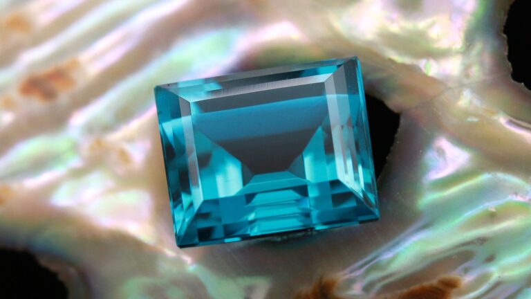 A natural 3.01 CT greenish blue rectangular cut Tourmaline. This stone is for sale at Sindur Fine & Antique Jewelry.