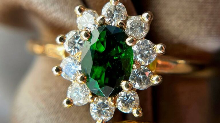 A green tourmaline ring with a diamond halo.