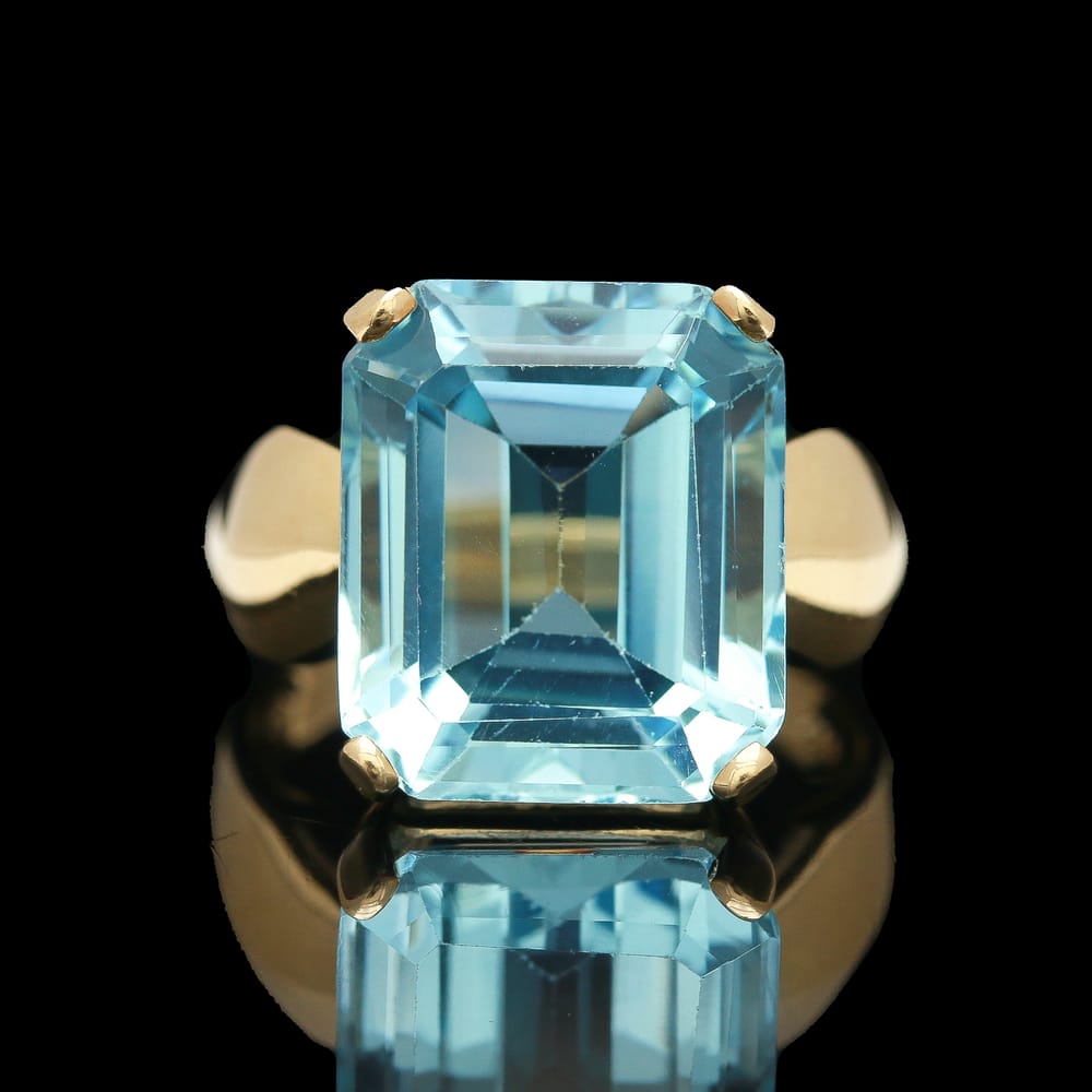 008-000702_1QeYzoIAF 10k Yellow Gold 12 ct Emerald Cut Blue Topaz Ring